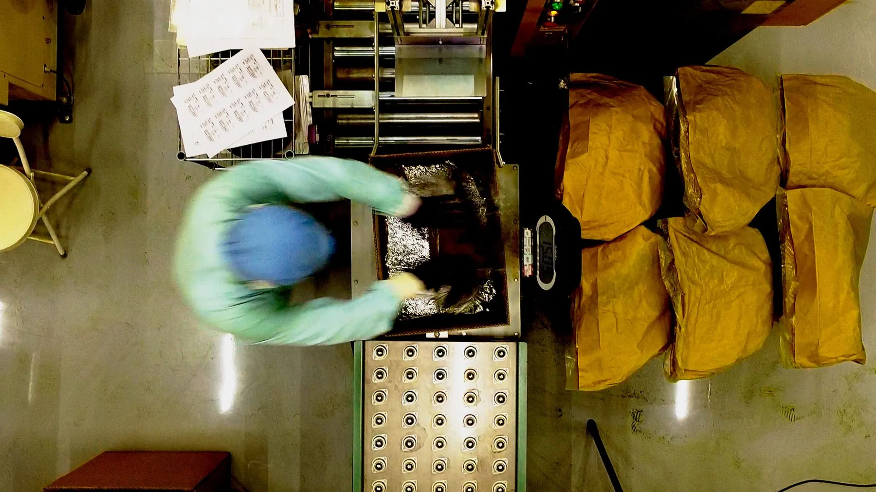 Top-down view of matcha packing at Chato's facility