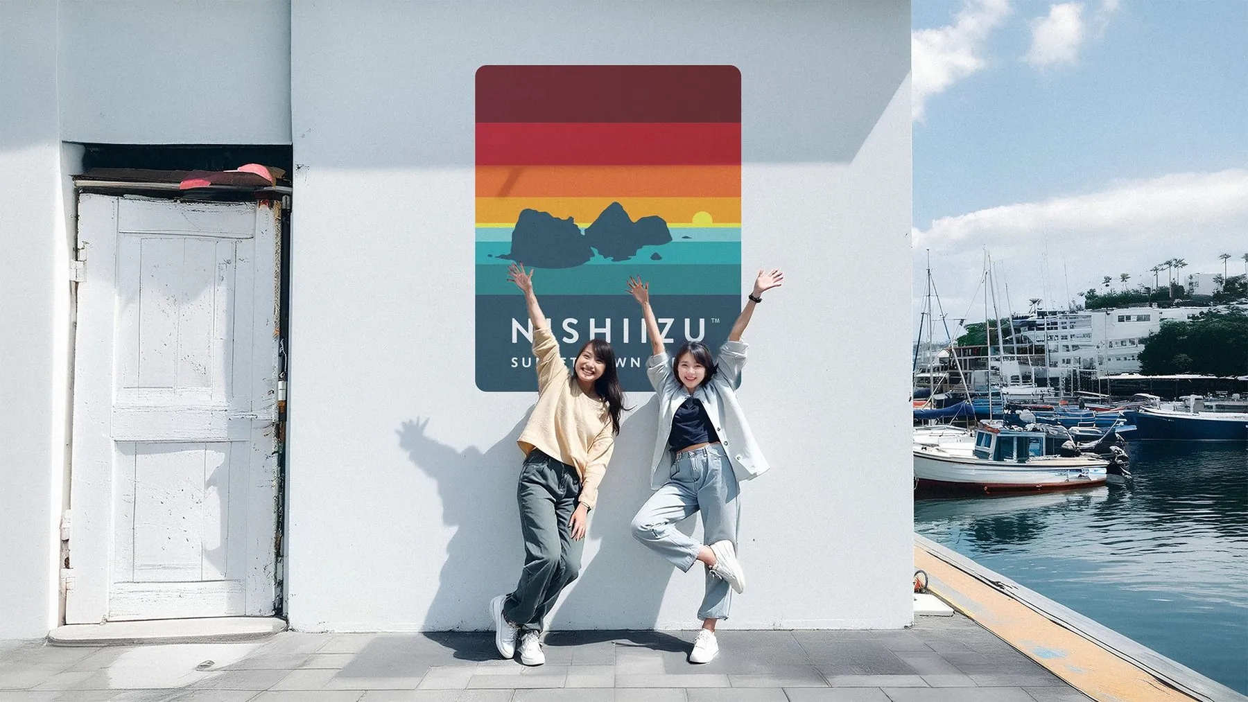 Nishiizu logo painted on a harbor wall